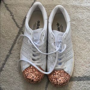 Used Adidas shell top with rose gold front . Size9